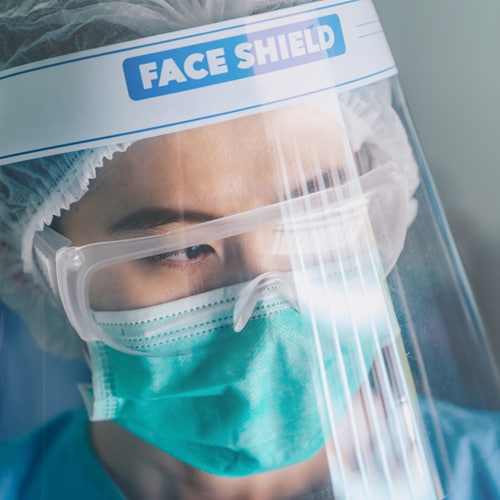 Dental practitioner wearing PPE