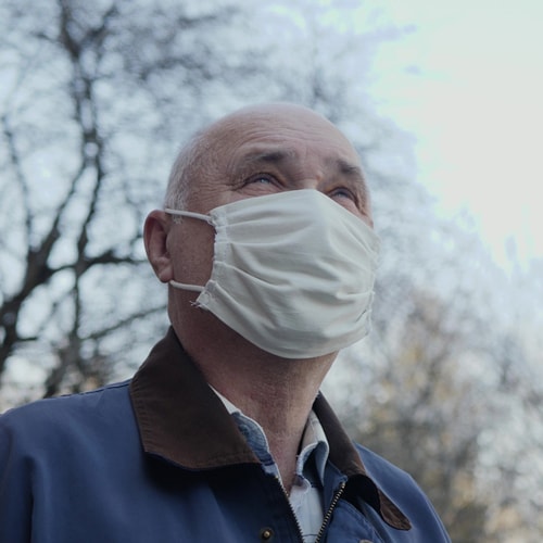 portrait-elderly-man-handmade-mask-on