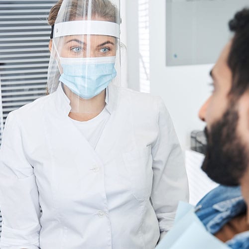 portrait-view-female-dentist-wearing-protective